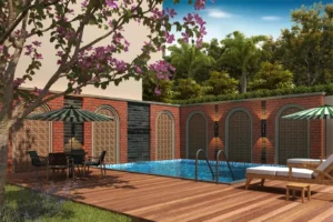 View of Bellemont Mansion villa's private swimming pool surrounded by lush greenery.