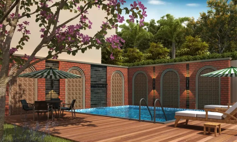 View of Bellemont Mansion villa's private swimming pool surrounded by lush greenery.